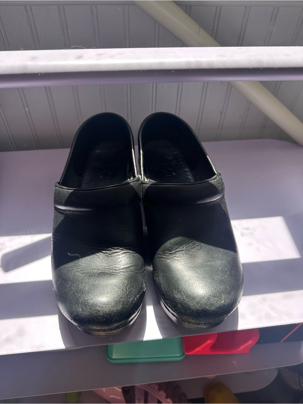 Dansko Black Leather Slip-On Women's Clogs